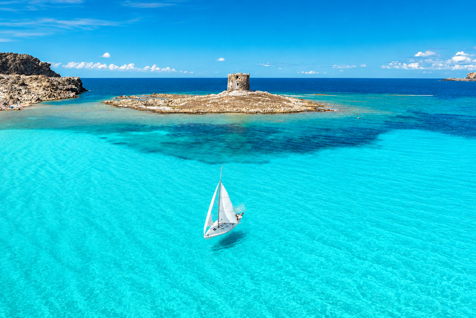 pelosa-acqua-turchese-sabbia-bianca